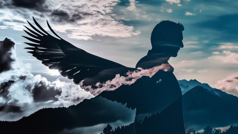 Double exposure of a silhouette of a man with wings and a cloudy sky over mountain peaks: freedom and imagination concept.
