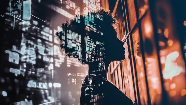 Double exposure of a silhouette of a person looking out a window and a cityscape with illuminated buildings at night: introspection and urban life concept.