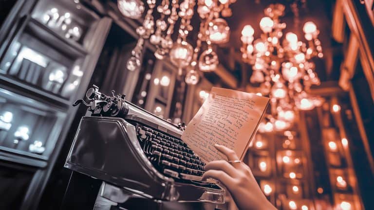 Double exposure of a vintage typewriter with a hand holding a handwritten page