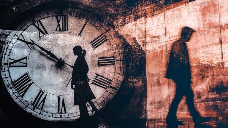 Double exposure of a silhouette of a woman inside a large clock face