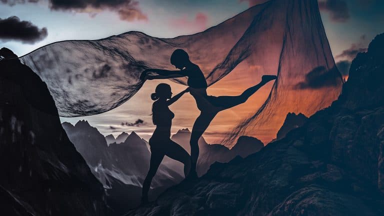 Double exposure of the silhouette of two dancers on rocky terrain