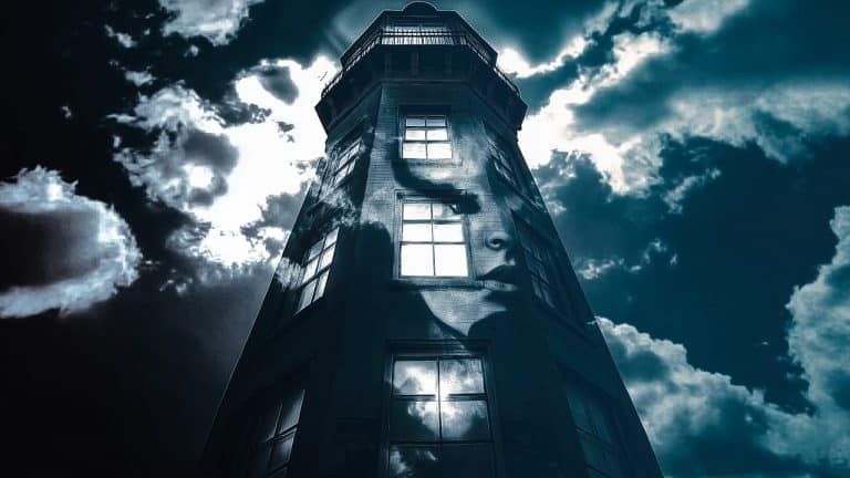 Double exposure of a tall lighthouse against a cloudy sky and a woman's face superimposed on the lighthouse: mystery and introspection concept.