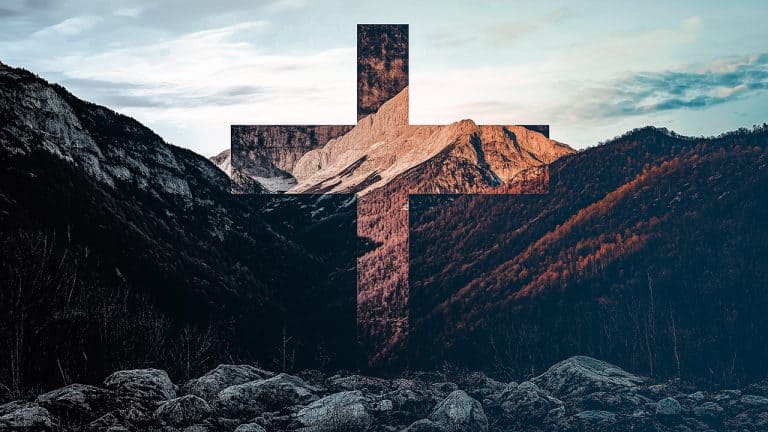 Double exposure of a mountain range at sunset with a cross shape overlay: spiritual and natural harmony concept.