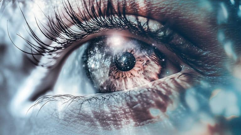 Double exposure of a close-up human eye with detailed eyelashes and a galaxy filled with stars and cosmic elements: universe within concept.