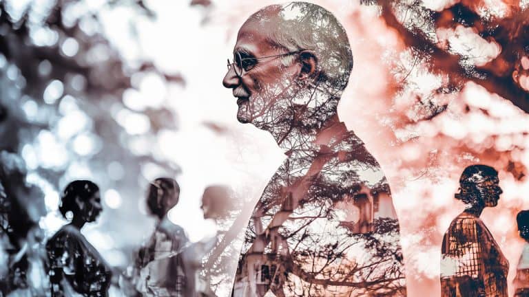 Double exposure of a man's profile with glasses overlaid with trees
