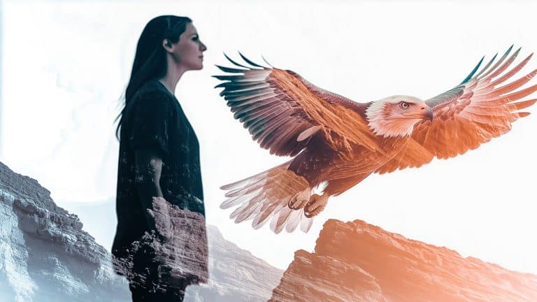 Double exposure of a woman standing in profile against a rocky landscape
