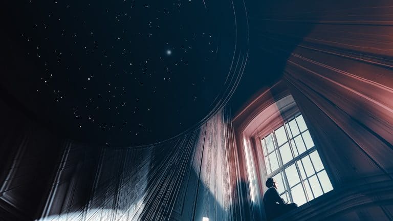 Double exposure of a person sitting on a windowsill gazing outside