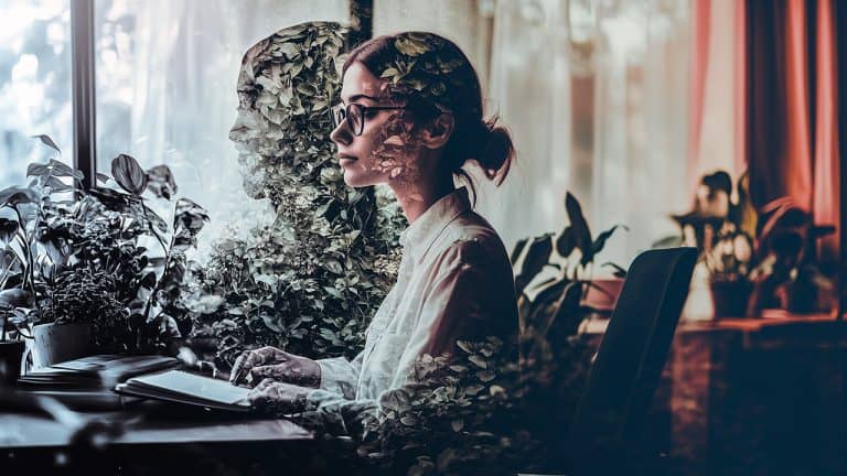 Double exposure of a woman sitting at a desk with a notebook