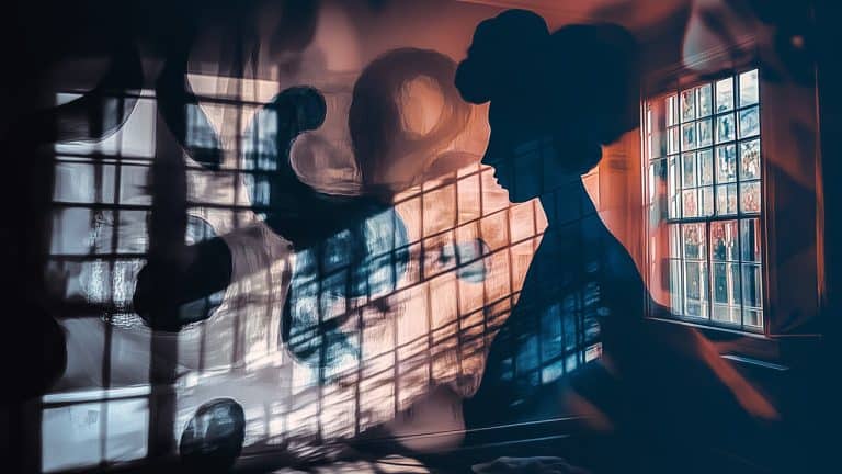 Double exposure of a woman's silhouette with natural light streaming through a window
