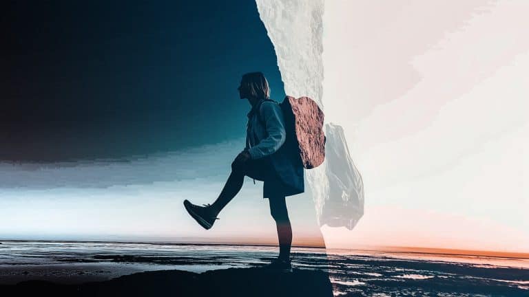 Double exposure of a silhouette of a person with a backpack stepping forward against a blue sky