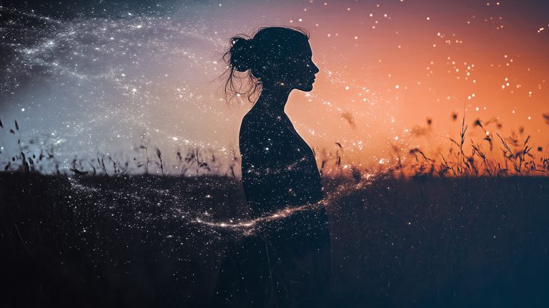 Double exposure of a silhouette of a woman standing in a field at sunset