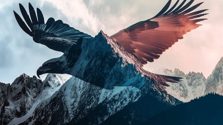 Double exposure of an eagle in flight and a snow-covered mountain range: freedom and majesty concept.