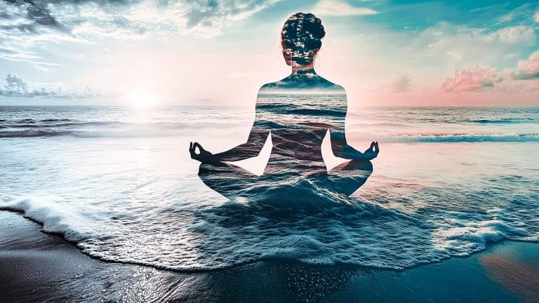 Double exposure of a person meditating in lotus position and ocean waves at sunrise: tranquility and mindfulness concept.