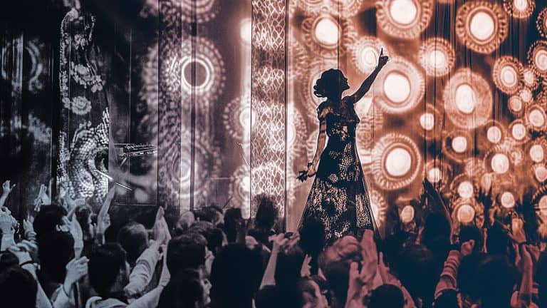 Double exposure of a silhouette of a performer on stage with intricate light patterns